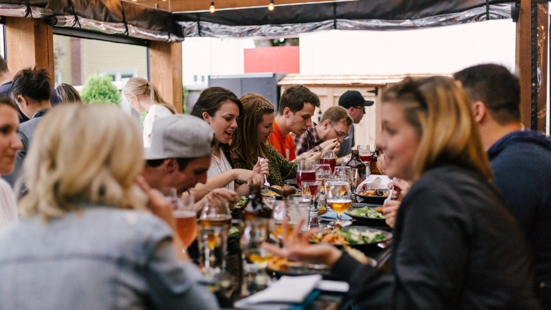 patrons enjoying great food and drinks in a restauant