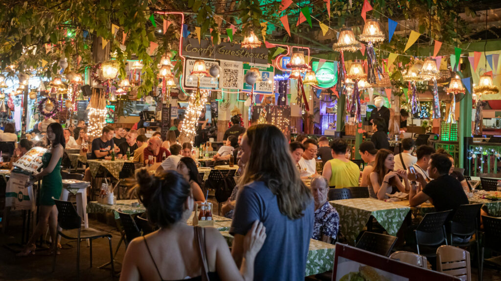 people in a cosy busy restaurant enjoying their evening