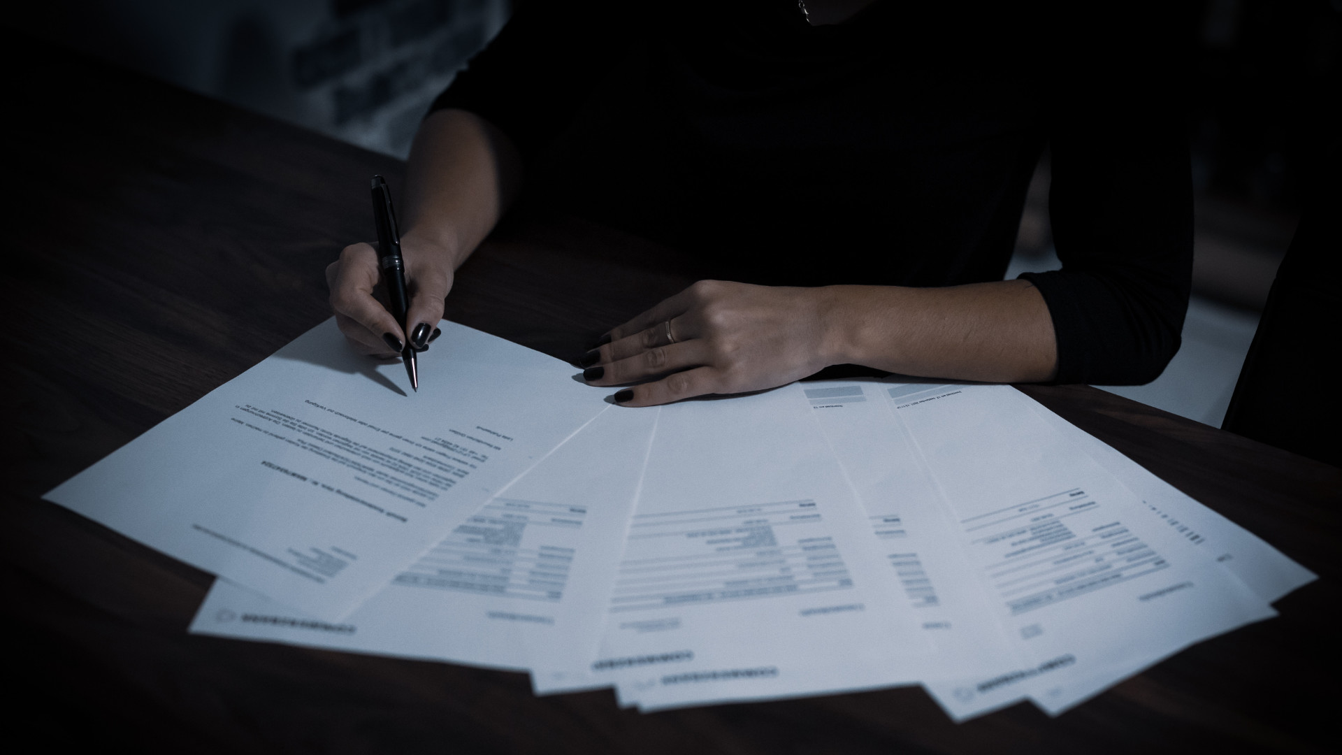 Person filling out paperwork